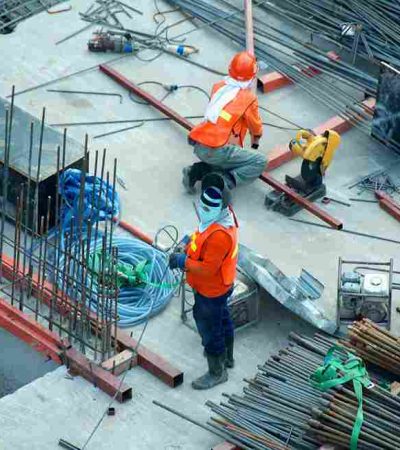 Professional construction team working on building site